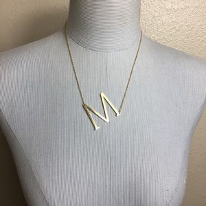 New gold “M” pendant necklace